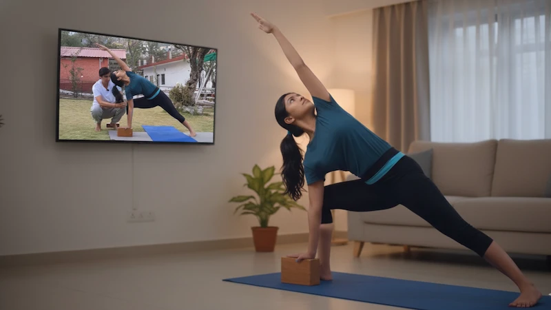 A group of students in various yoga poses during a comprehensive 500-hour online yoga teacher training course