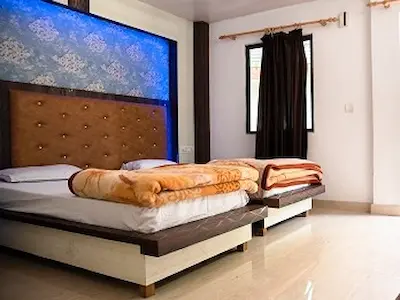 Comfortable shared twin room for students at Raj Yoga Rishikesh