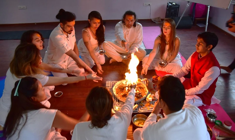 Group of students practicing yoga teacher training in Rishikesh at Raj Yoga